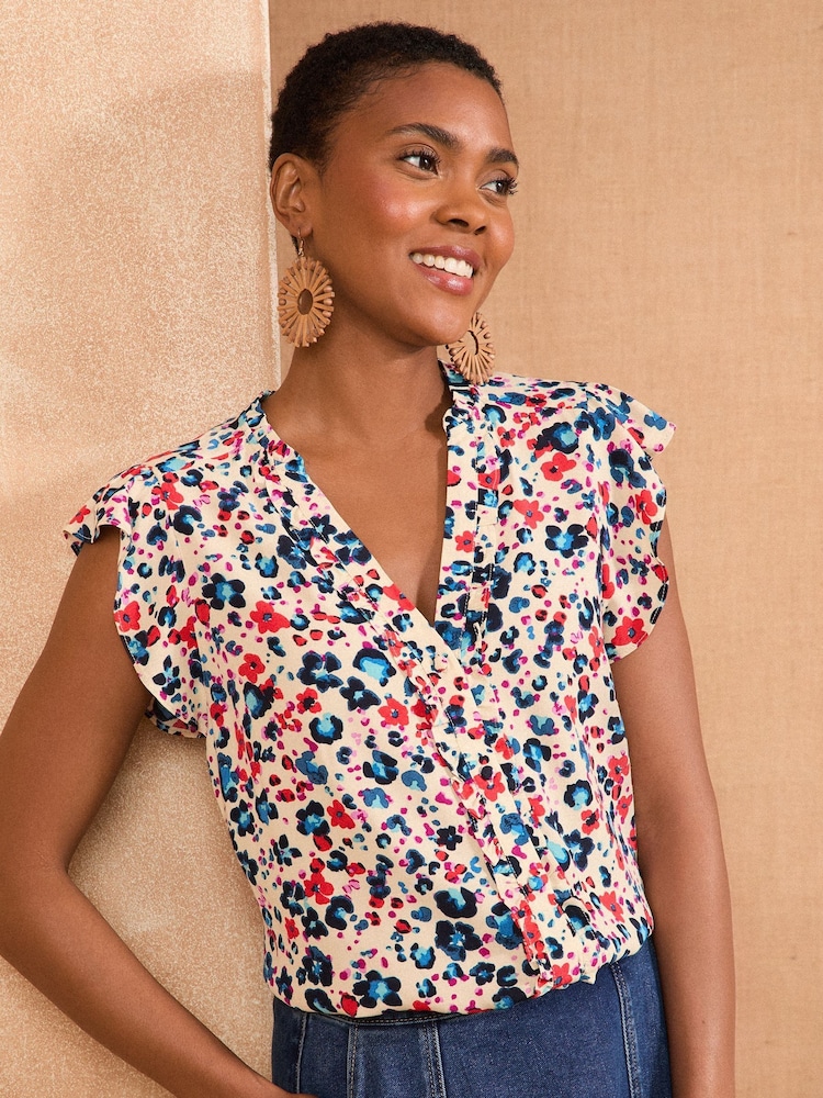 Love & Roses White Ecru Animal Print Flutter Sleeve Printed V-Neck Blouse - Image 1 of 4