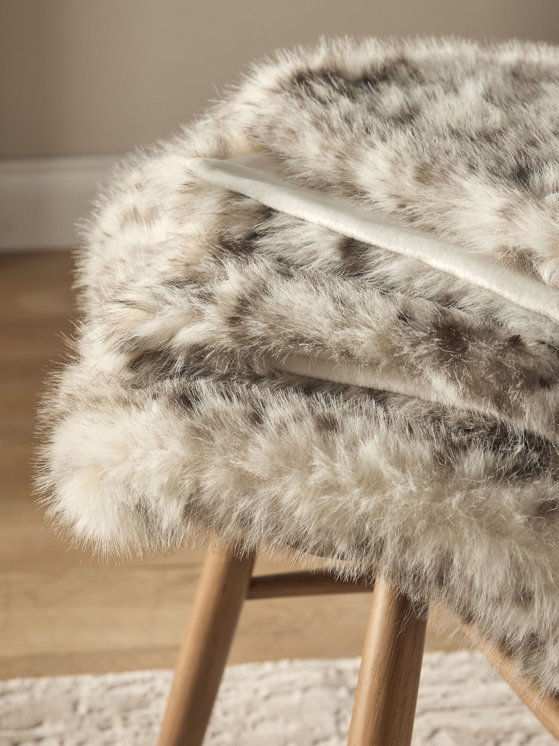 Buy Grey Snow Leopard Print Faux Fur Throw from Next United Arab Emirates