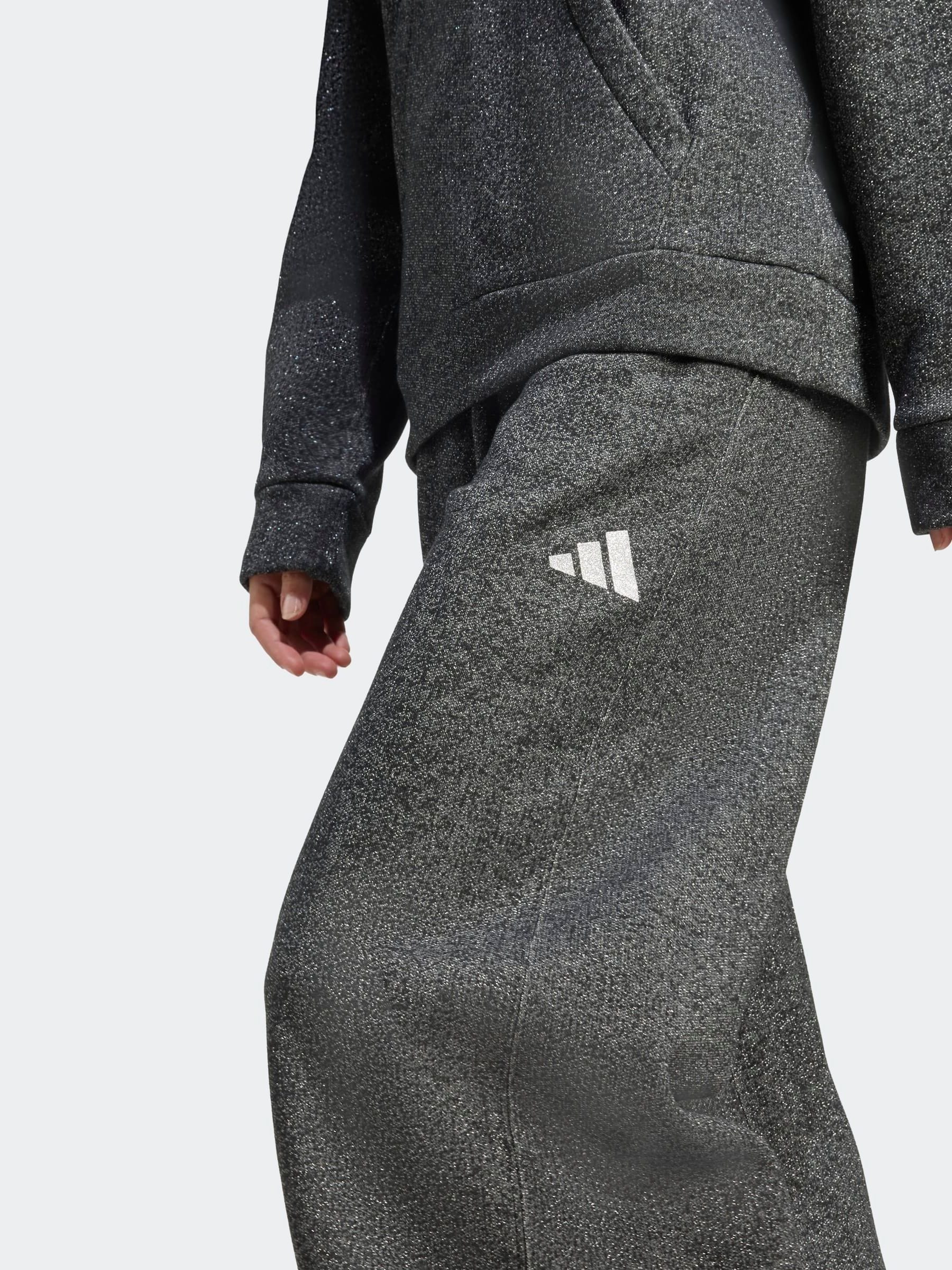 Cumpără Negru - Pantaloni sport largi din fleece cu sclipici Cumpără Negru - Pantaloni sport largi din fleece cu sclipici