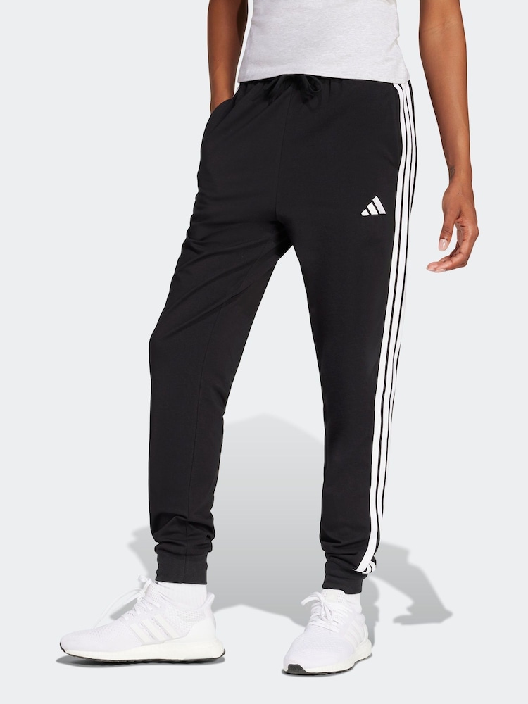 adidas Black Essentials 3-Stripes Cuffed Joggers - Image 1 of 6 adidas Black Essentials 3-Stripes Cuffed Joggers - Image 1 of 6