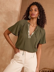 Love & Roses Khaki Green Sequin V-Neck blouse - Image 1 of 4