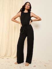 Friends Like These Black Scoop Neck Sleveless Wide Leg Jersey Jumpsuit - Image 1 of 4