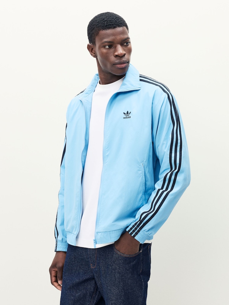 adidas Originals Blue Adicolor Woven Firebird Jacket - Image 1 of 7 adidas Originals Blue Adicolor Woven Firebird Jacket - Image 1 of 7