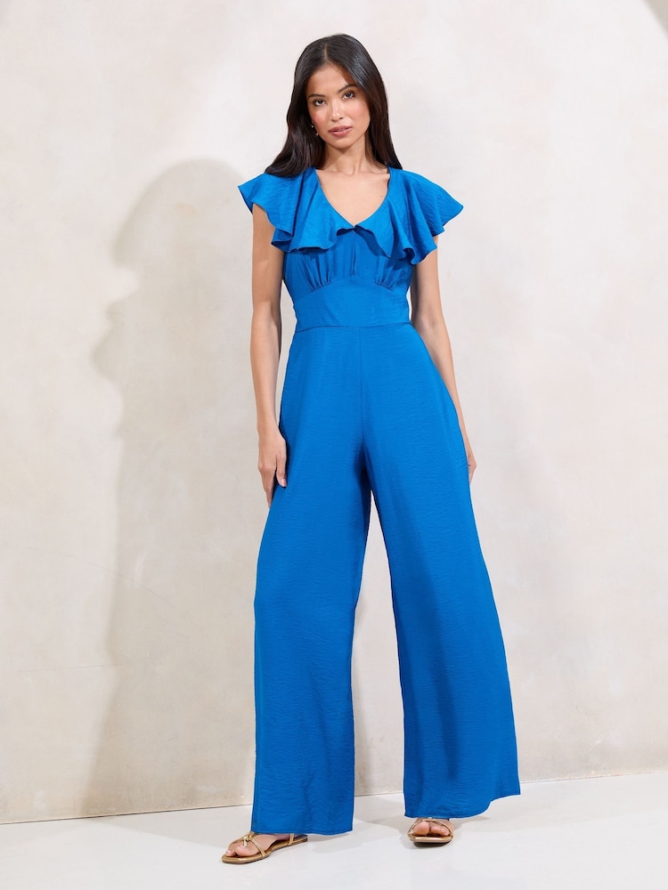 Lipsy Blue V-Neck Ruffle Detail Short Sleeve Jumpsuit - Image 1 of 4