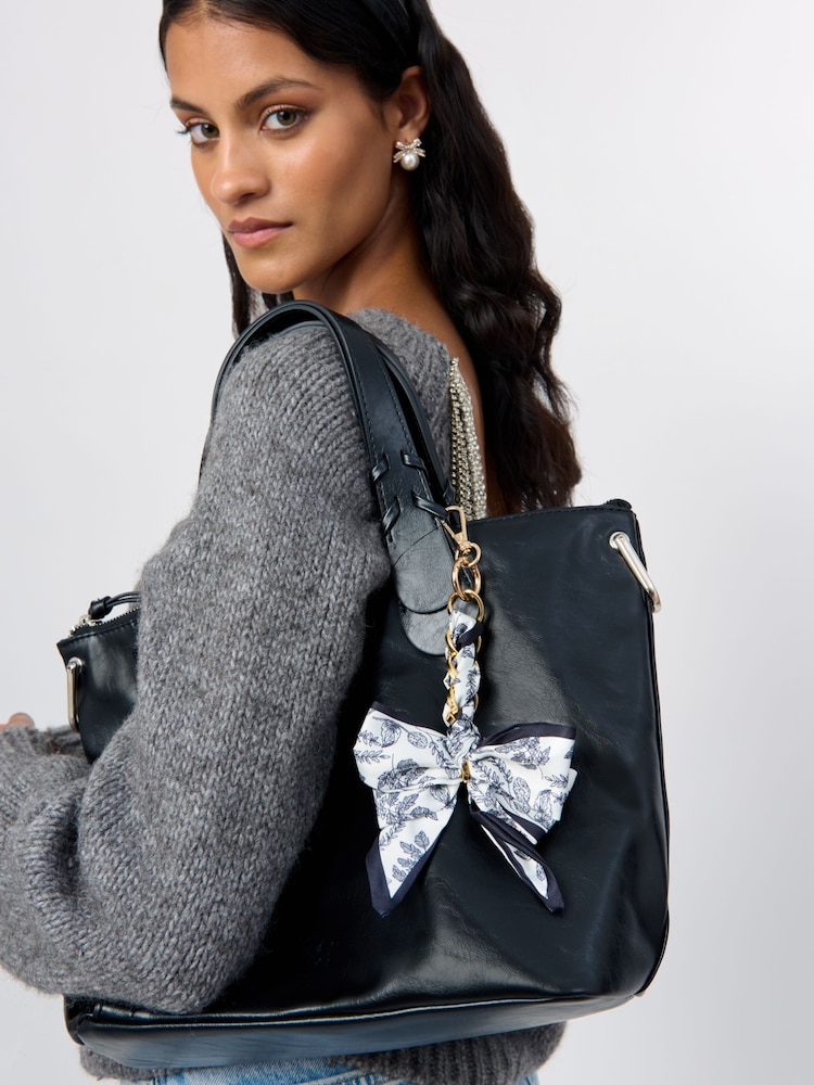Aela Blue Print Bow Bag Charm - Image 1 of 3 Aela Blue Print Bow Bag Charm - Image 1 of 3