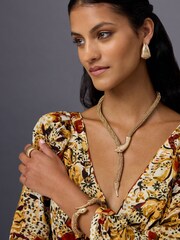 Aela Gold Tone Rhinestone Wrapped Snake Clamp Bangle - Image 1 of 3