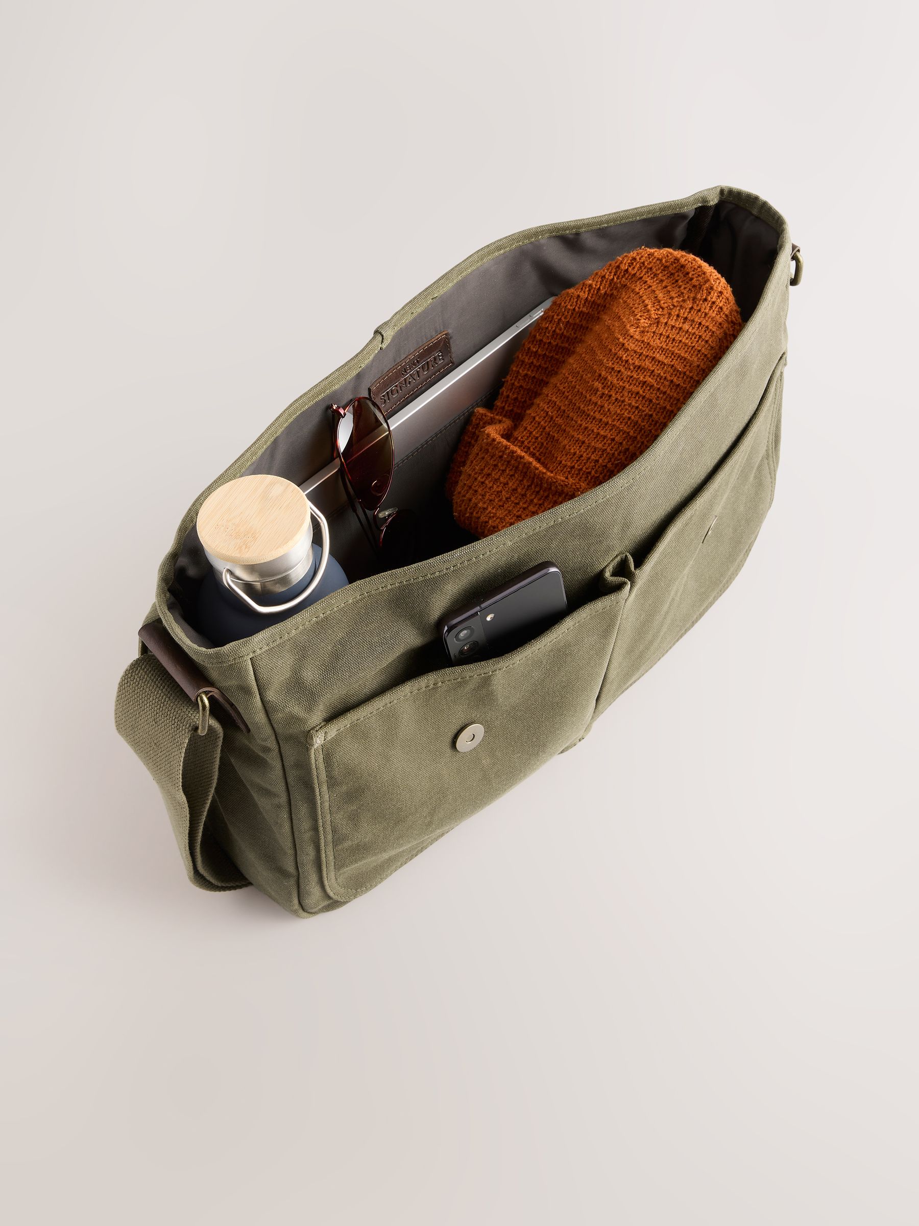 Buy Green Wax Cotton Messenger Bag from Next USA