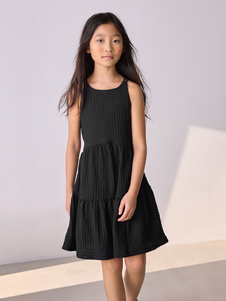 Black Strappy Crinkle Summer Dress (3-16yrs) - Image 1 of 8 Black Strappy Crinkle Summer Dress (3-16yrs) - Image 1 of 8