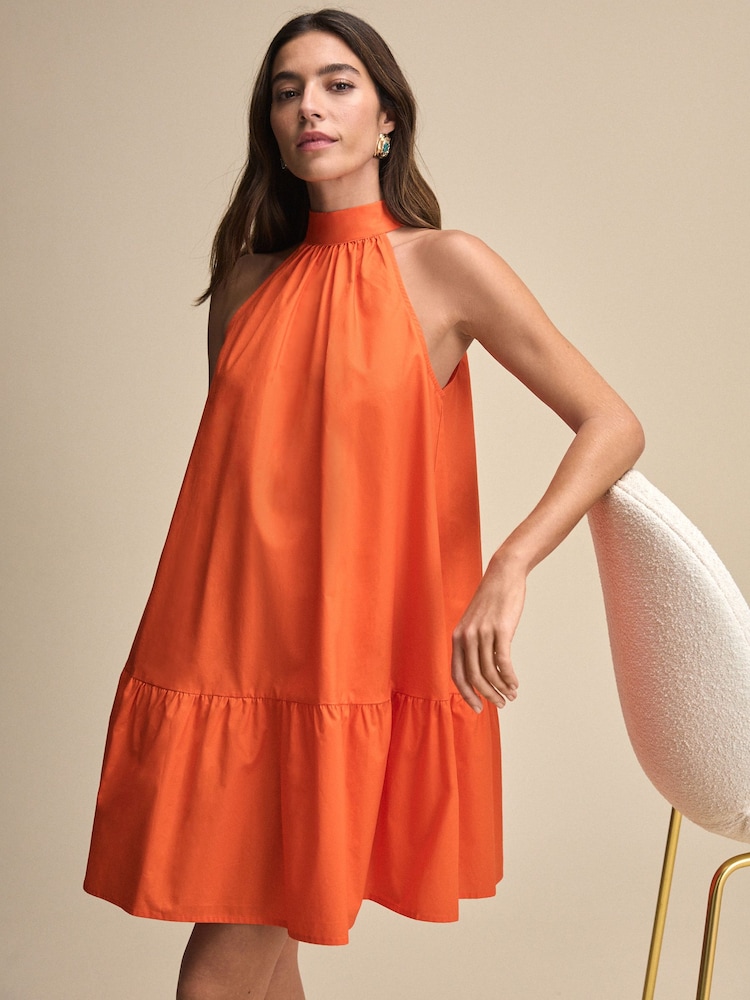 Orange 100% Cotton Halter Tie Neck Sleeveless Tiered Mini Dress - Image 1 of 7 Orange 100% Cotton Halter Tie Neck Sleeveless Tiered Mini Dress - Image 1 of 7