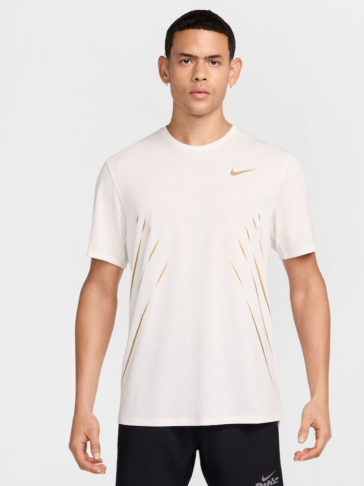 Nike White/Gold Dri-FIT Jakob Ingebrigtsen Running T-Shirt - Image 1 of 7