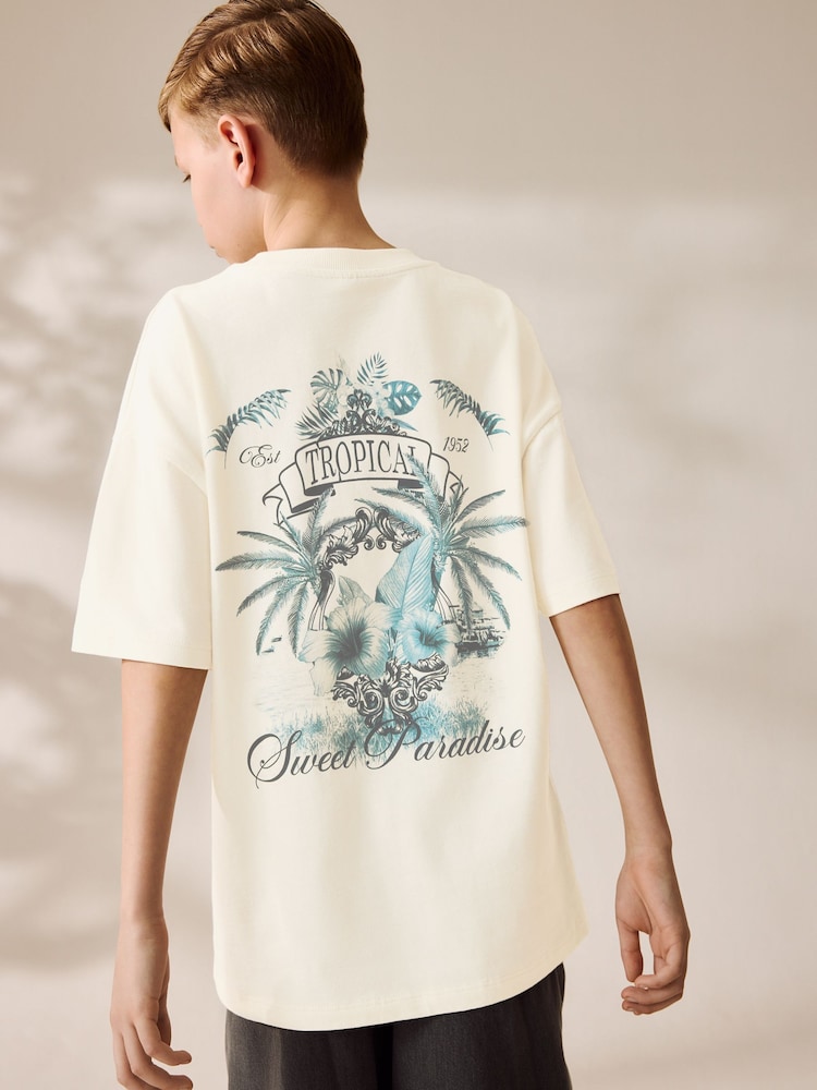 Crema con estampado trasero de palmera - Camiseta holgada de manga corta con estampado gráfico (3-16 años) - Imagen 1 de 7