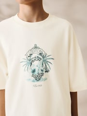 Crema con estampado trasero de palmera - Camiseta holgada de manga corta con estampado gráfico (3-16 años) - Imagen 3 de 7