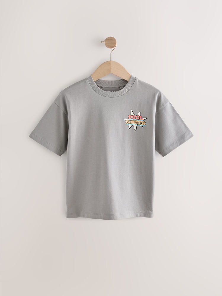 Gris con estampado de verano en la espalda - Camiseta holgada de manga corta con estampado gráfico (3-16 años) - Imagen 1 de 4