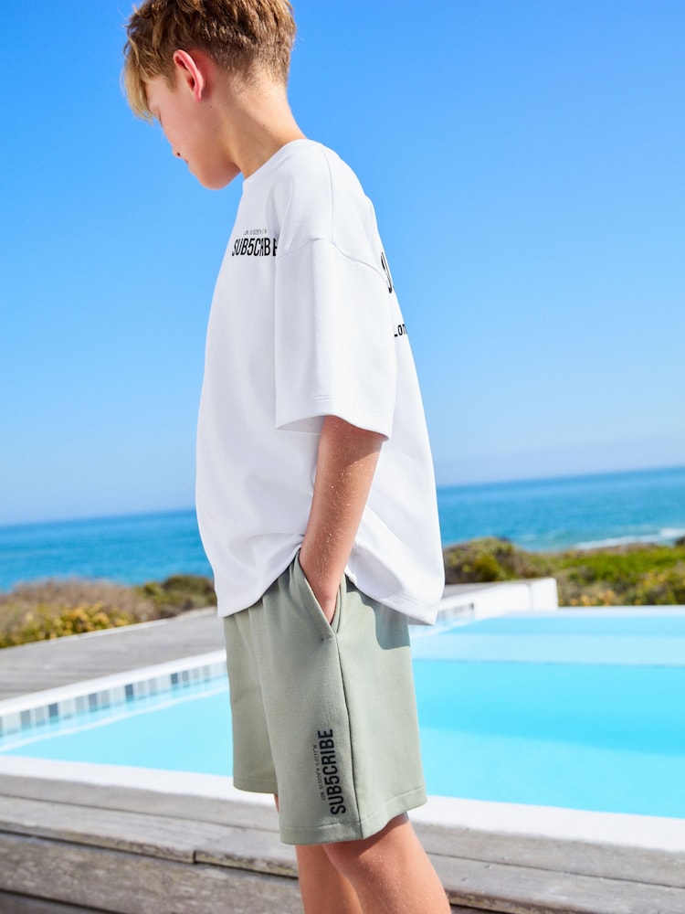 White/Sage Green Subscribe Boxy Fit Short Sleeve T-Shirt and Shorts Set (3-16yrs) - Image 1 of 7