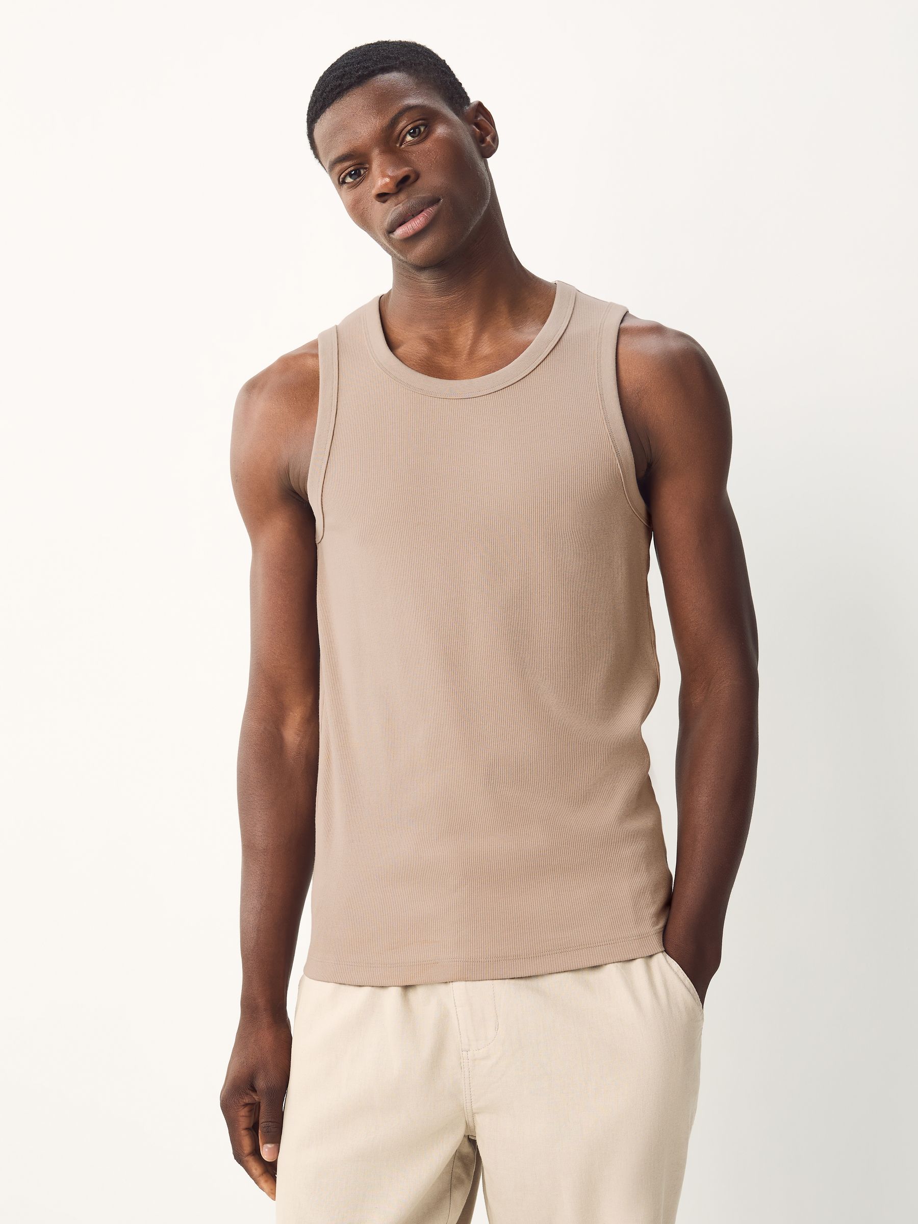Buy Black/White/Neutral/Navy 4 Pack Slim Ribbed Vests from Next USA