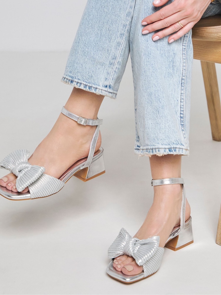 Simply Be Silver Low Heel Occasion Bow Sandals In Wide Fit - Image 1 of 4 Simply Be Silver Low Heel Occasion Bow Sandals In Wide Fit - Image 1 of 4
