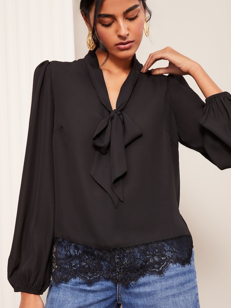 Friends Like These Black Long Sleeve Bow Front Lace Hem Blouse - Image 1 of 4