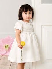 JoJo Maman Bébé Cream Smocked Puff Sleeve Cotton Satin Flower Girl Dress - Image 1 of 8