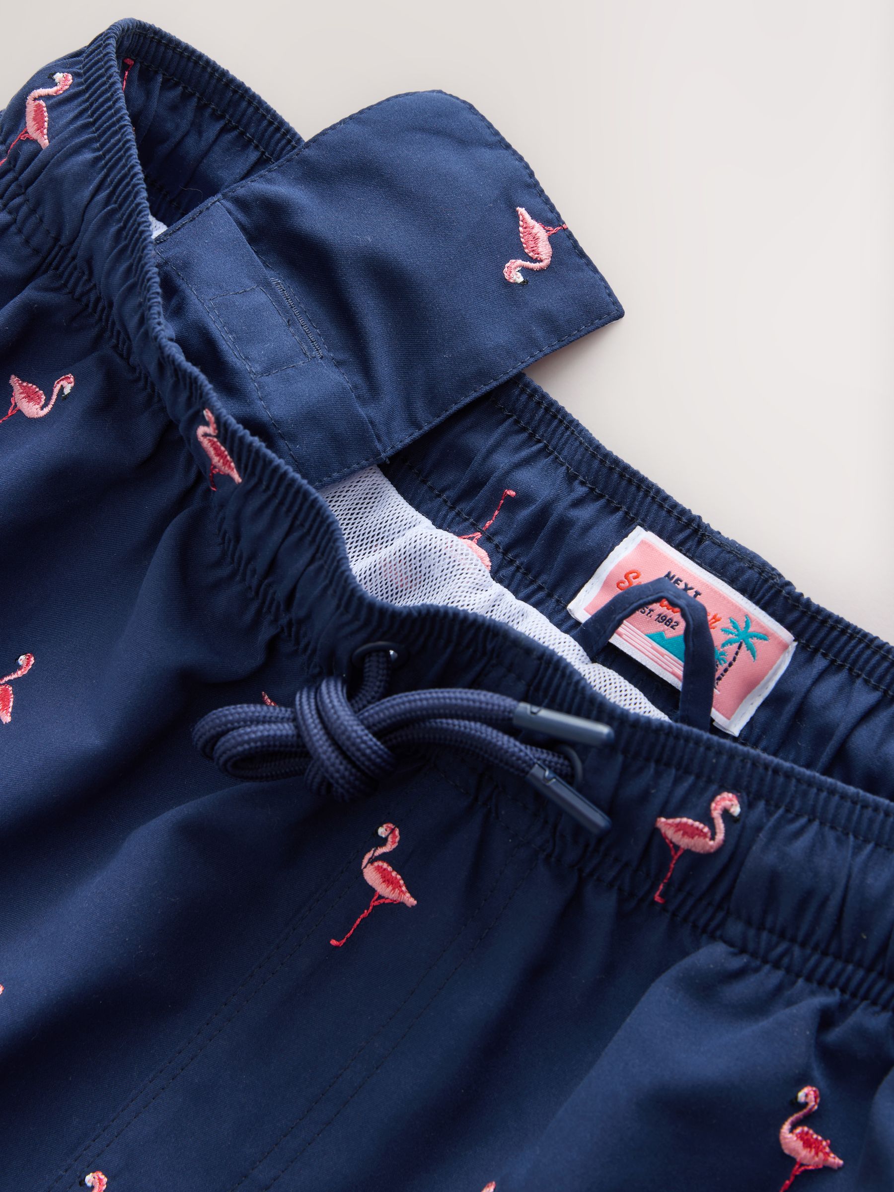 Buy Navy Blue Flamingo Embroidered Swim Shorts from Next USA