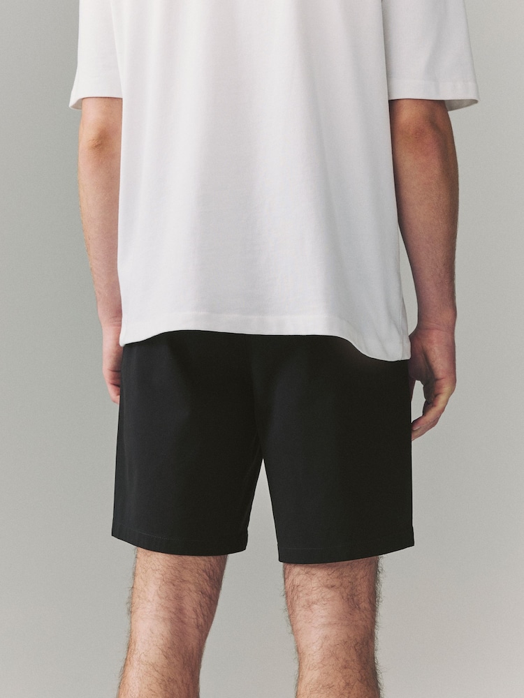 Negro - Corte amplio - Pantalones cortos chinos elásticos - Imagen 2 de 9 Negro - Corte amplio - Pantalones cortos chinos elásticos - Imagen 2 de 9