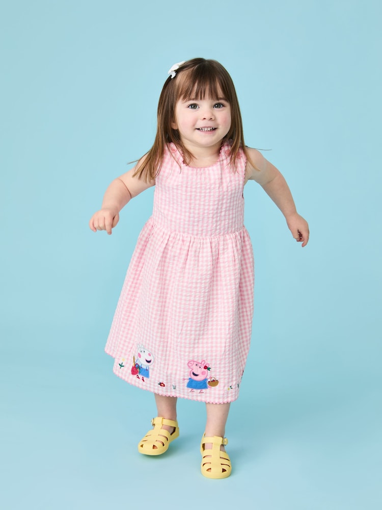 Vestido con espalda cruzada de cuadros con apliques de Peppa Pig de Jojo Maman Bébé - Imagen 1 de 7 Vestido con espalda cruzada de cuadros con apliques de Peppa Pig de Jojo Maman Bébé - Imagen 1 de 7
