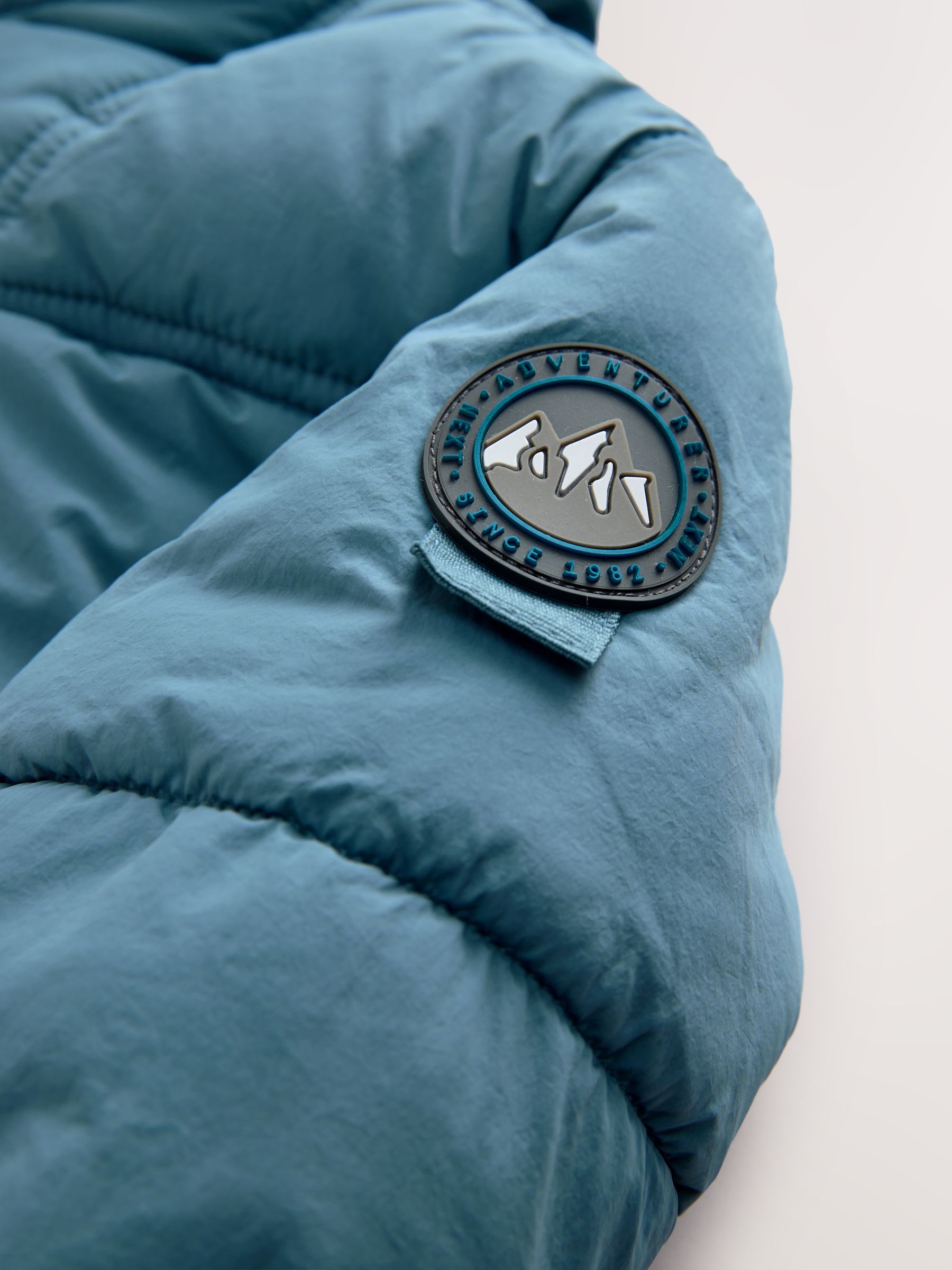 Buy Blue Borg Lined Padded Shower Resistant Coat (3mths-7yrs) from