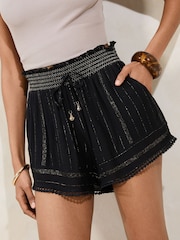 Lipsy Black Sparkle Petite Beach Shorts with Pom Trim - Image 1 of 4