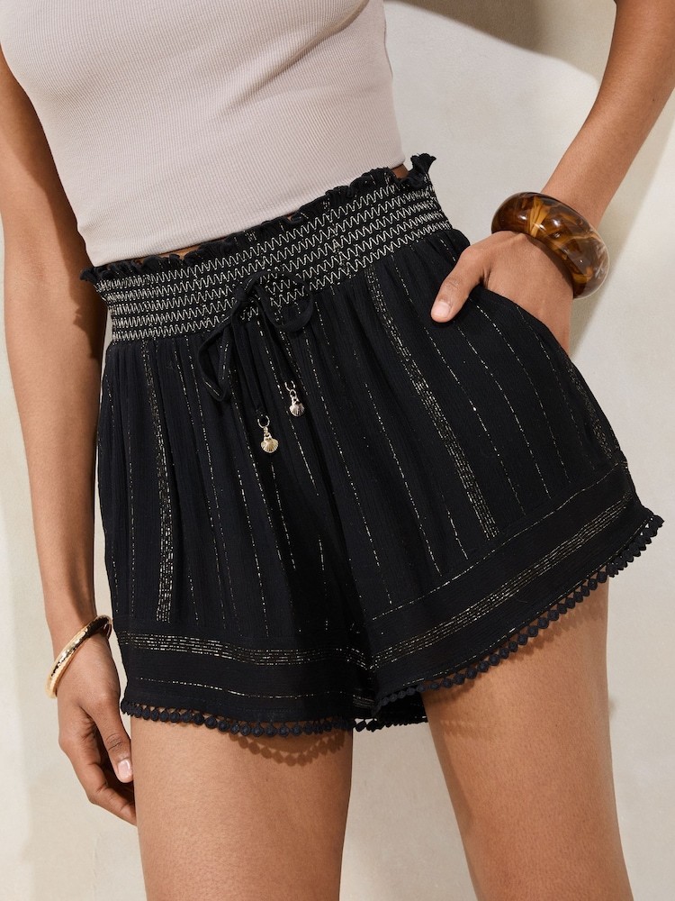 Lipsy Black Sparkle Petite Beach Shorts with Pom Trim - Image 1 of 4