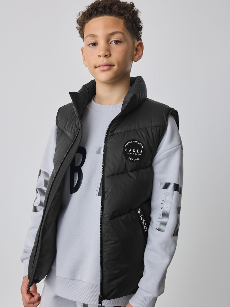 Baker by Ted Baker Shower Resistant Padded Black Gilet - Image 1 of 12 Baker by Ted Baker Shower Resistant Padded Black Gilet - Image 1 of 12