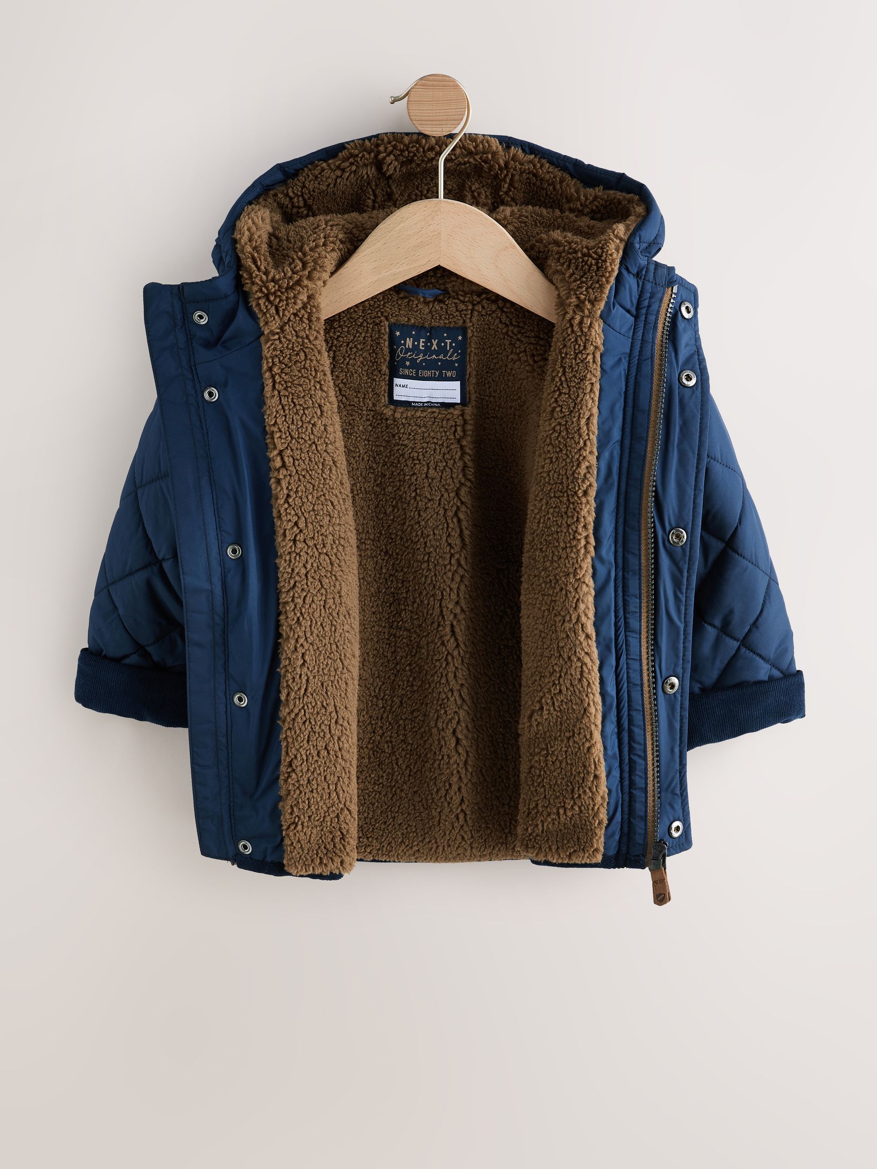 Buy Navy Borg Lined Quilted Coat (3mths-7yrs) from the Next UK