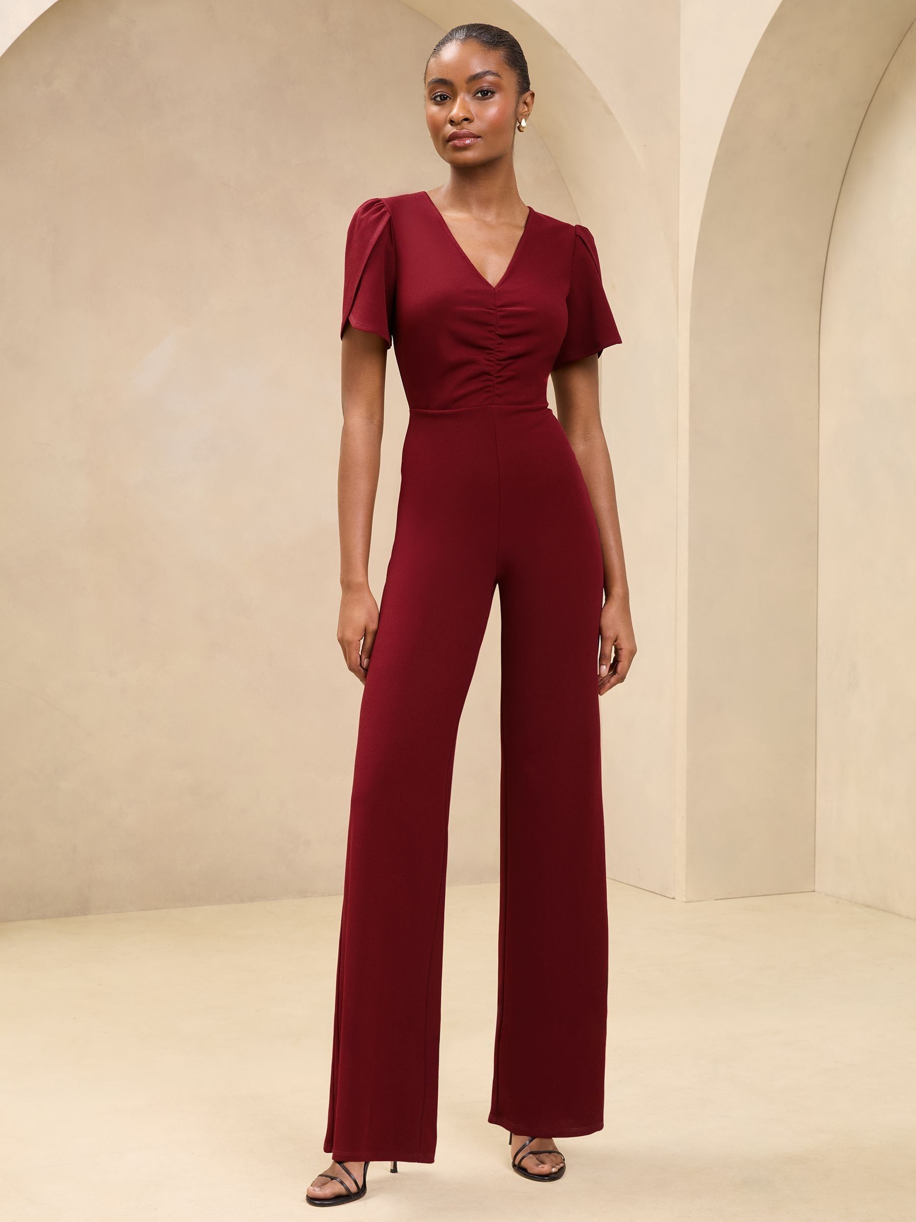 Buy Burgundy Red Short Sleeve Ruched Front V Neck Jumpsuit from the Next UK online shop