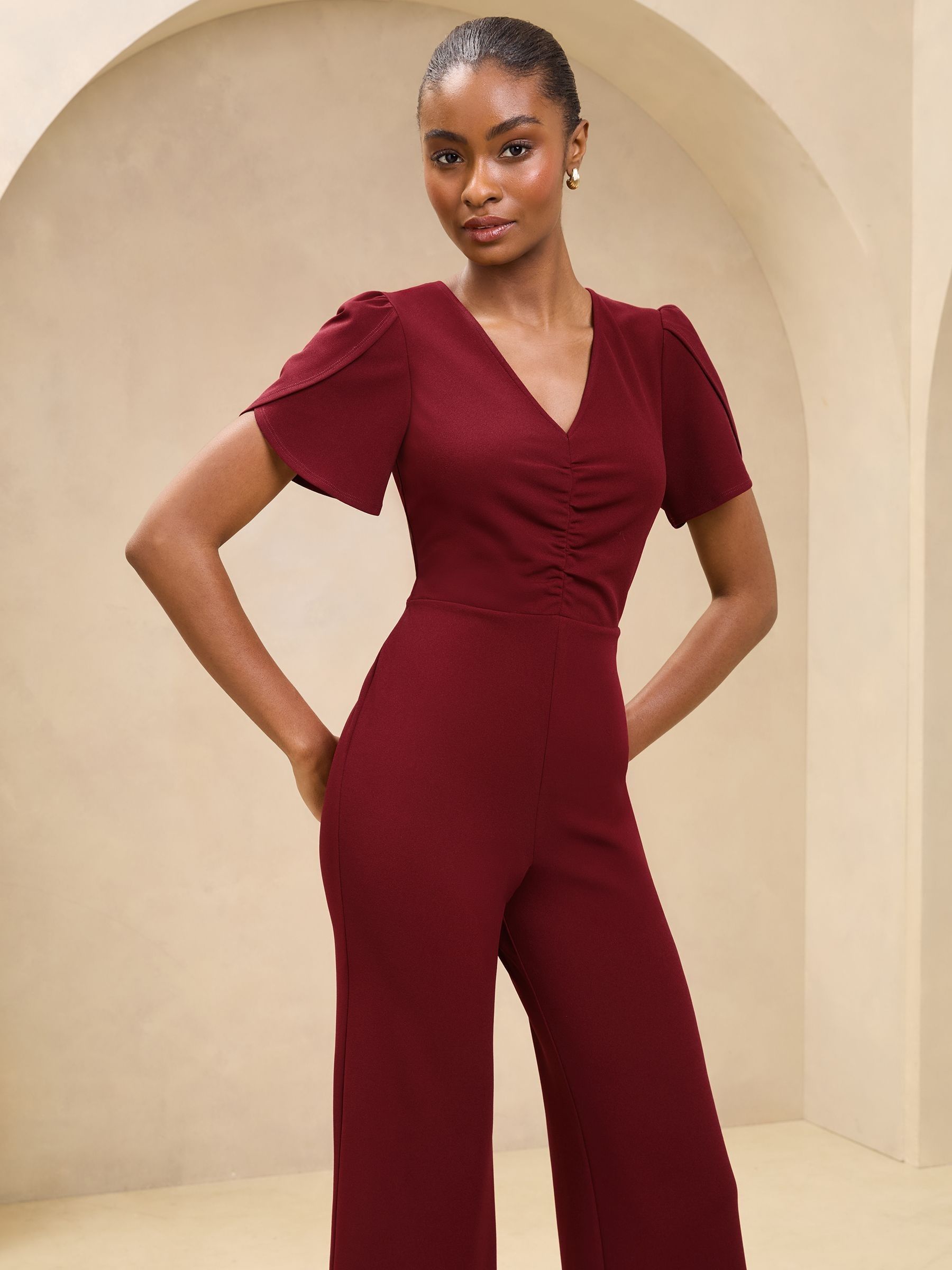 Buy Burgundy Red Short Sleeve Ruched Front V Neck Jumpsuit from the Next UK online shop