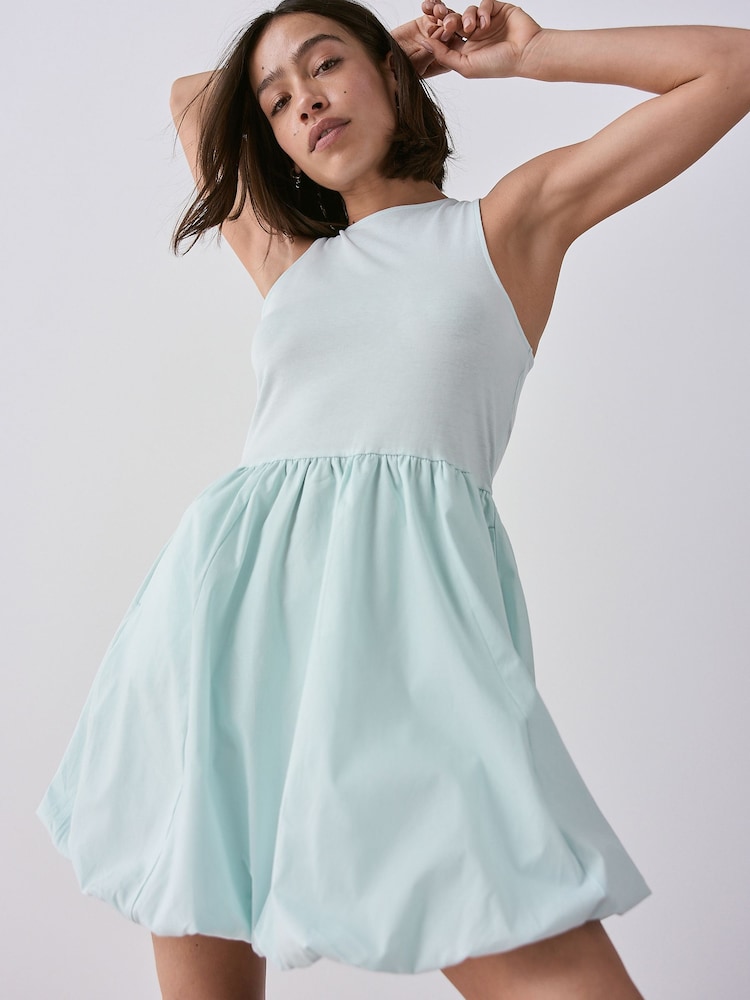 Light Blue Puffball Hem Woven Jersey Mix 100% Cotton Mini Dress - Image 1 of 7 Light Blue Puffball Hem Woven Jersey Mix 100% Cotton Mini Dress - Image 1 of 7