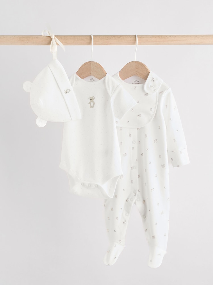 White Baby Sleepsuit, Bodysuit, Beanie and Bib Set 4 Piece (0-9mths) - Image 1 of 19 White Baby Sleepsuit, Bodysuit, Beanie and Bib Set 4 Piece (0-9mths) - Image 1 of 19