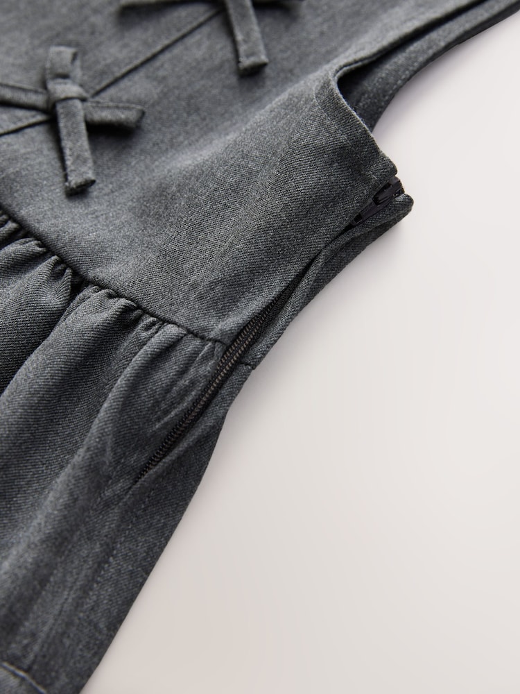 Grey Asymmetric Bow Front School Pinafore Dress (3-14yrs) - Image 9 of 9 Grey Asymmetric Bow Front School Pinafore Dress (3-14yrs) - Image 9 of 9