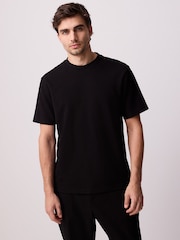 Schwarz - Reguläre Passform - Elegantes T-Shirt aus schwerem Material und weichem Tragegefühl - Bild 1 von 8