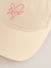 Lipsy Cream and Pink Embriodered Graphic Cap - Image 6 of 6