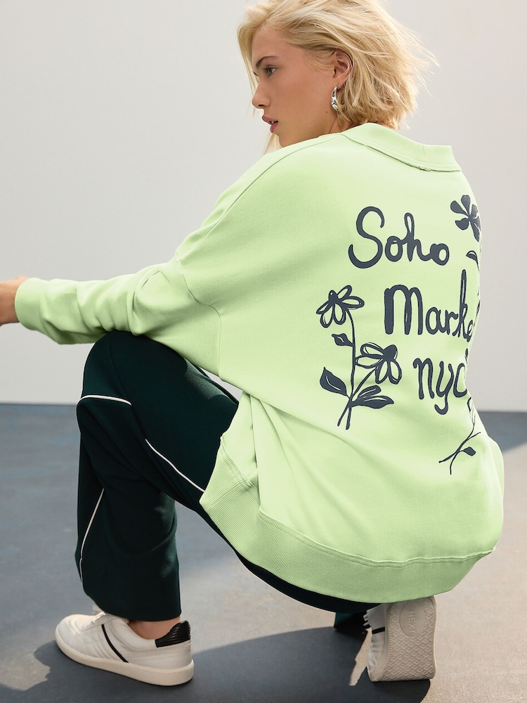 Green NYC Back Graphic Boyfriend Oversized Varsity Style Jersey Longline Cardigan - Image 1 of 8 Green NYC Back Graphic Boyfriend Oversized Varsity Style Jersey Longline Cardigan - Image 1 of 8