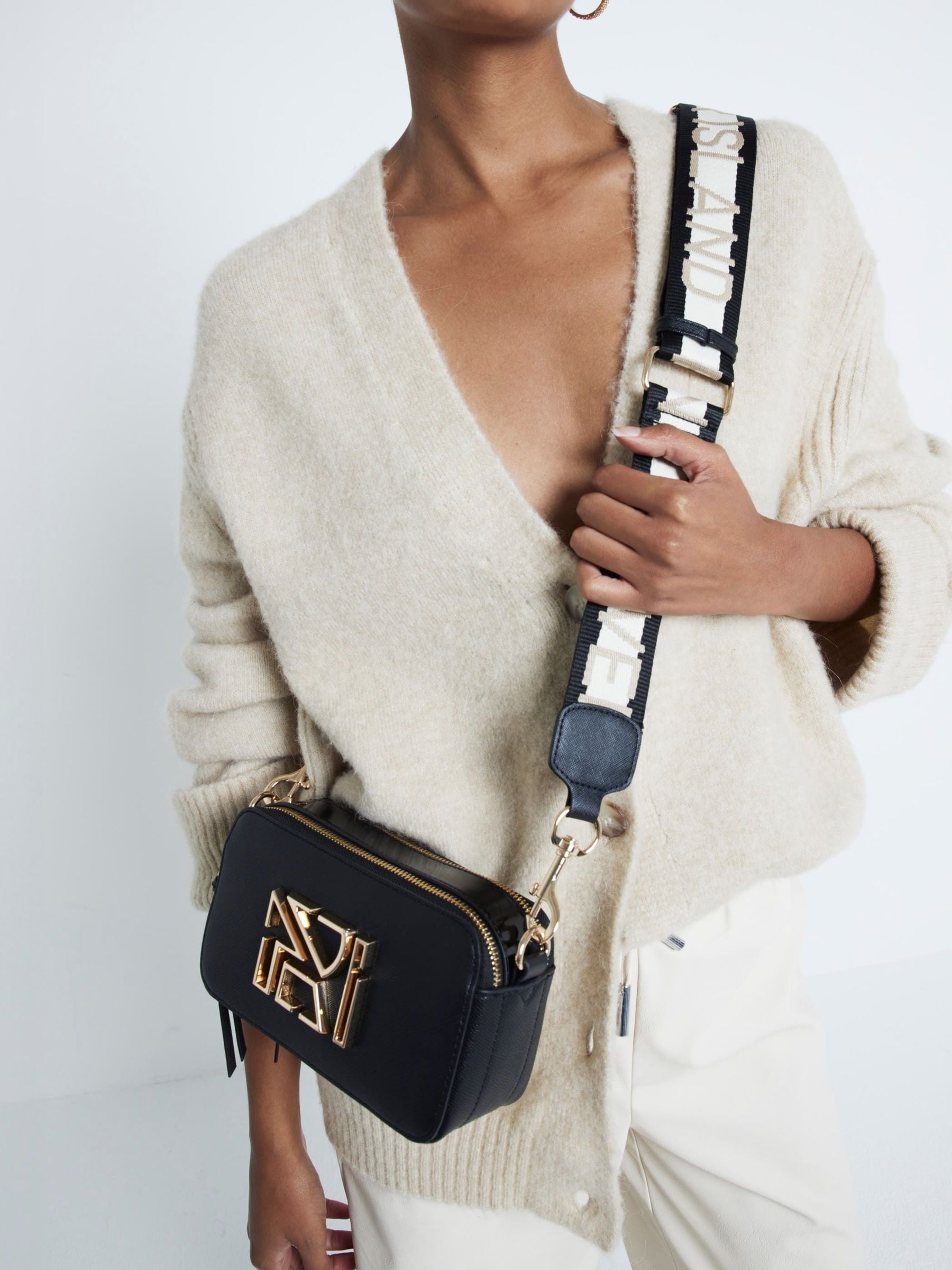 River island black buckle side cross body bag sale