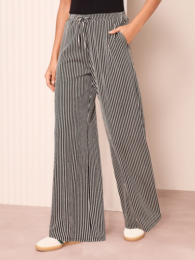 Friends Like These Black Stripe Crinkle Jersey Wide Leg Trousers - Image 1 of 4