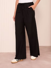 Friends Like These Black Crinkle Jersey Wide Leg Trousers - Image 1 of 4