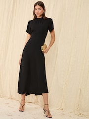 Friends Like These Black Petite High Neck Long Sleeve Midi Dress with Bow Detailing - Image 1 of 4