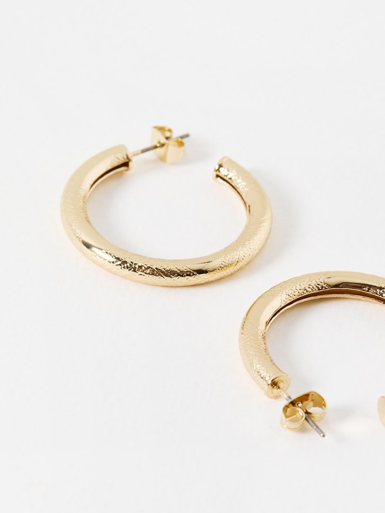 Oliver Bonas Gold Tone Ziada Textured Small Hoops - Image 3 of 3 Oliver Bonas Gold Tone Ziada Textured Small Hoops - Image 3 of 3