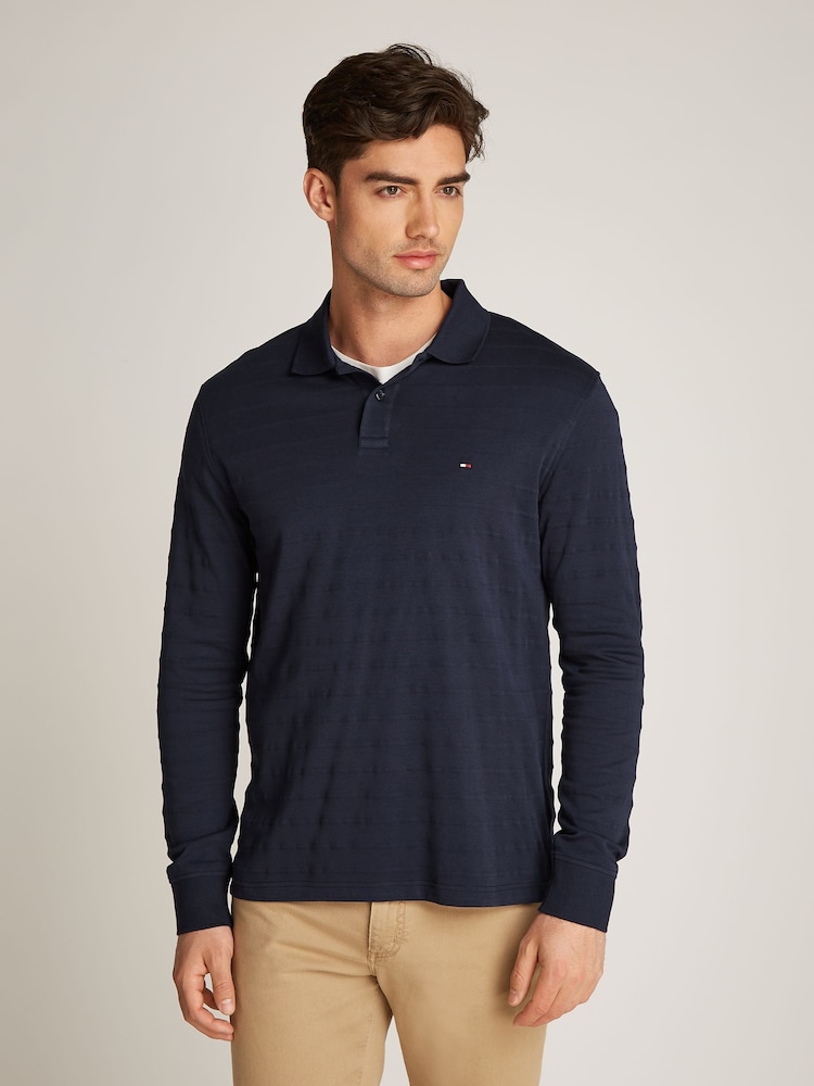 Tommy Hilfiger Blue Regular Fit Jacquard Stripe Long Sleeve 100% Cotton Polo Shirt - Image 1 of 6 Tommy Hilfiger Blue Regular Fit Jacquard Stripe Long Sleeve 100% Cotton Polo Shirt - Image 1 of 6