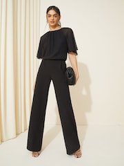 Friends Like These Black Petite Chiffon Flutter Sleeve Wide Leg Jumpsuit - Image 1 of 4