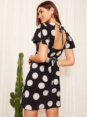 Friends Like These Black/White Flutter Sleeve Tie Back Mini Dress - Image 4 of 4