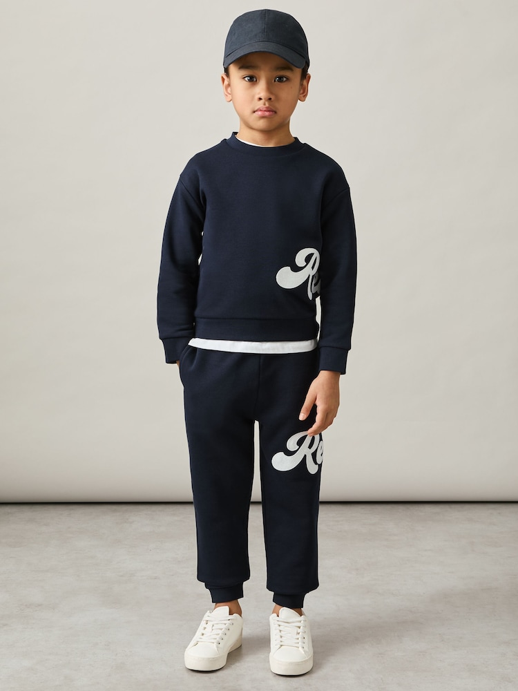 Reiss Navy Clayton 3-9 yrs Cotton-Blend Logo Script Joggers - Image 1 of 5