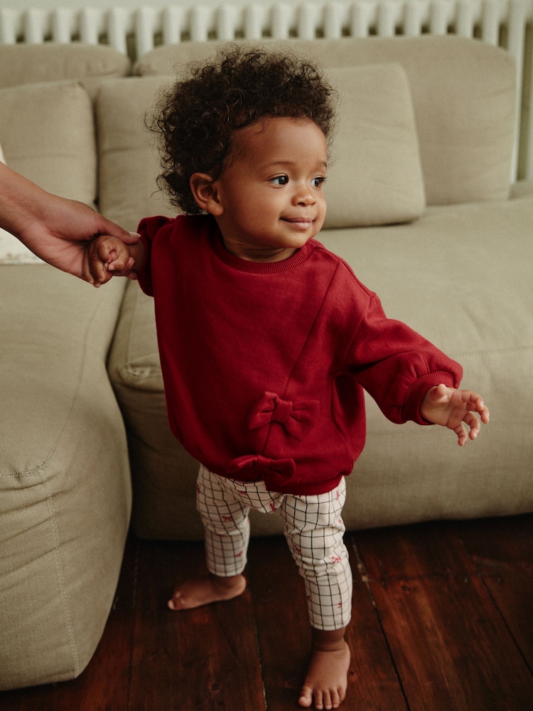Rot/Weiß mit Schleifenprint - Gemütliches, 2-teiliges Set mit Sweatshirt und Leggings für Babys - Bild 1 von 15 Rot/Weiß mit Schleifenprint - Gemütliches, 2-teiliges Set mit Sweatshirt und Leggings für Babys - Bild 1 von 15