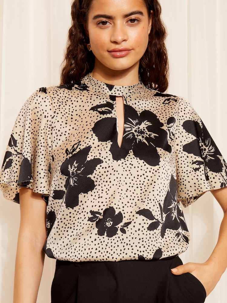 Friends Like These Floral Black/White Printed Flutter Sleeve Keyhole Blouse - Image 1 of 4