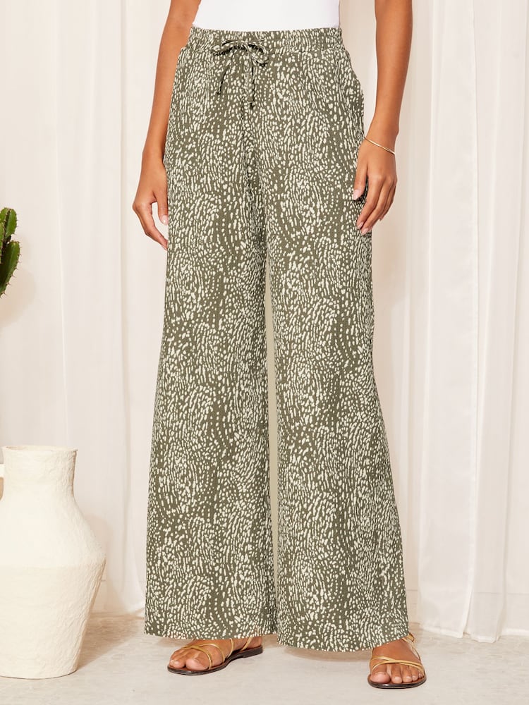 Friends Like These Khaki Green Wide Leg Crinkle Jersey Printed Elasticated Waist Trousers - Image 1 of 4